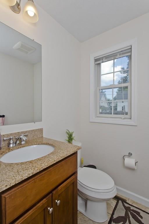 39 Spencer Street Springfield, MA 01118 - Photo 12 of 30 a bathroom with a granite countertop sink and a mirror