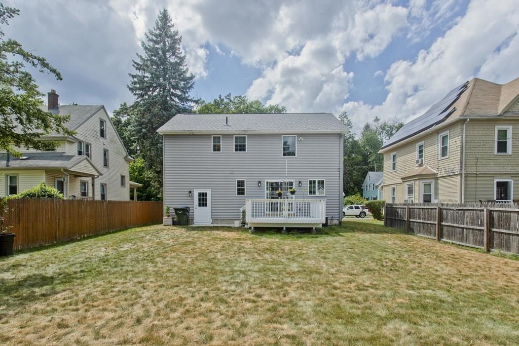 39 Spencer Street Springfield, MA 01118 - Photo 6 of 30 a view of a house with a yard and sitting area