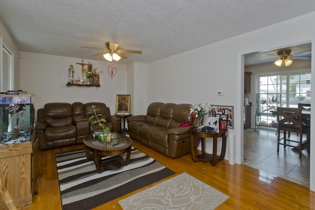 39 Spencer Street Springfield, MA 01118 - Photo 7 of 30 a living room with furniture and wooden floor