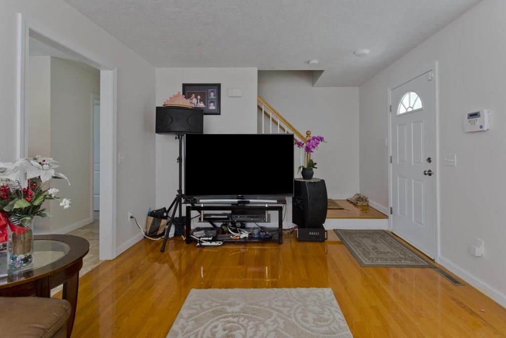 39 Spencer Street Springfield, MA 01118 - Photo 8 of 30 a room with furniture and a flat screen tv