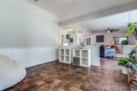a view of a livingroom with furniture and a window