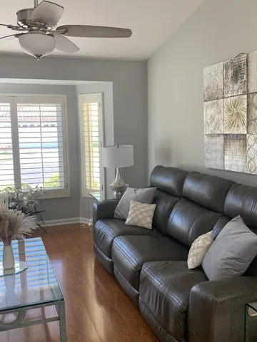 a view of a dining room with furniture and window