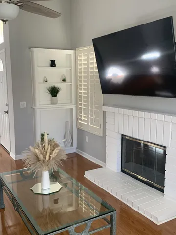 a kitchen with granite countertop stainless steel appliances and white cabinets