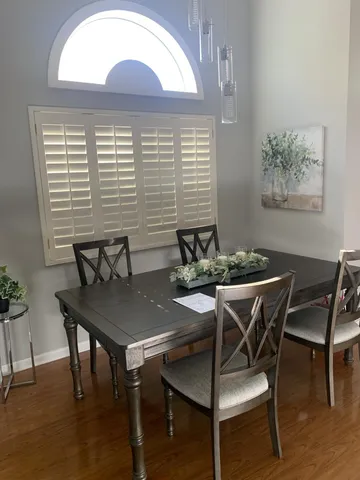 a work room with furniture and windows