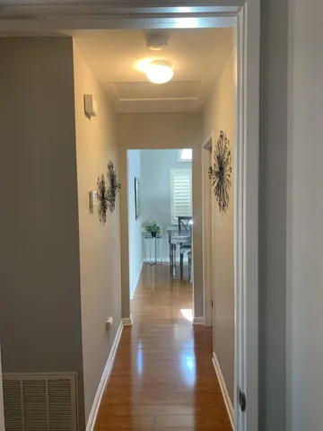 a spacious bedroom with a bed and a large window