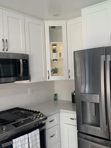 a kitchen that has a stove and a window
