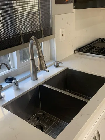a bathroom with a sink a vanity and mirror