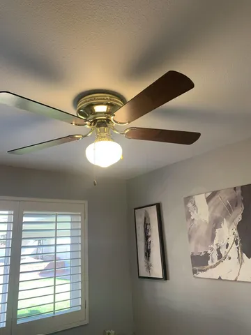 a room with wooden floor and shelf