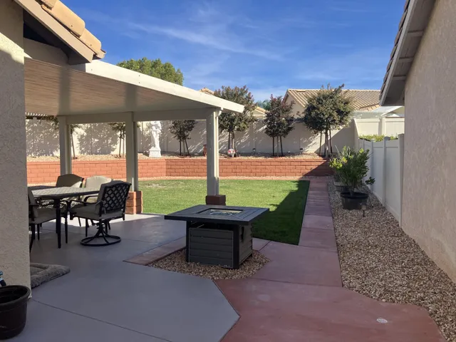 a view of a house with a tree
