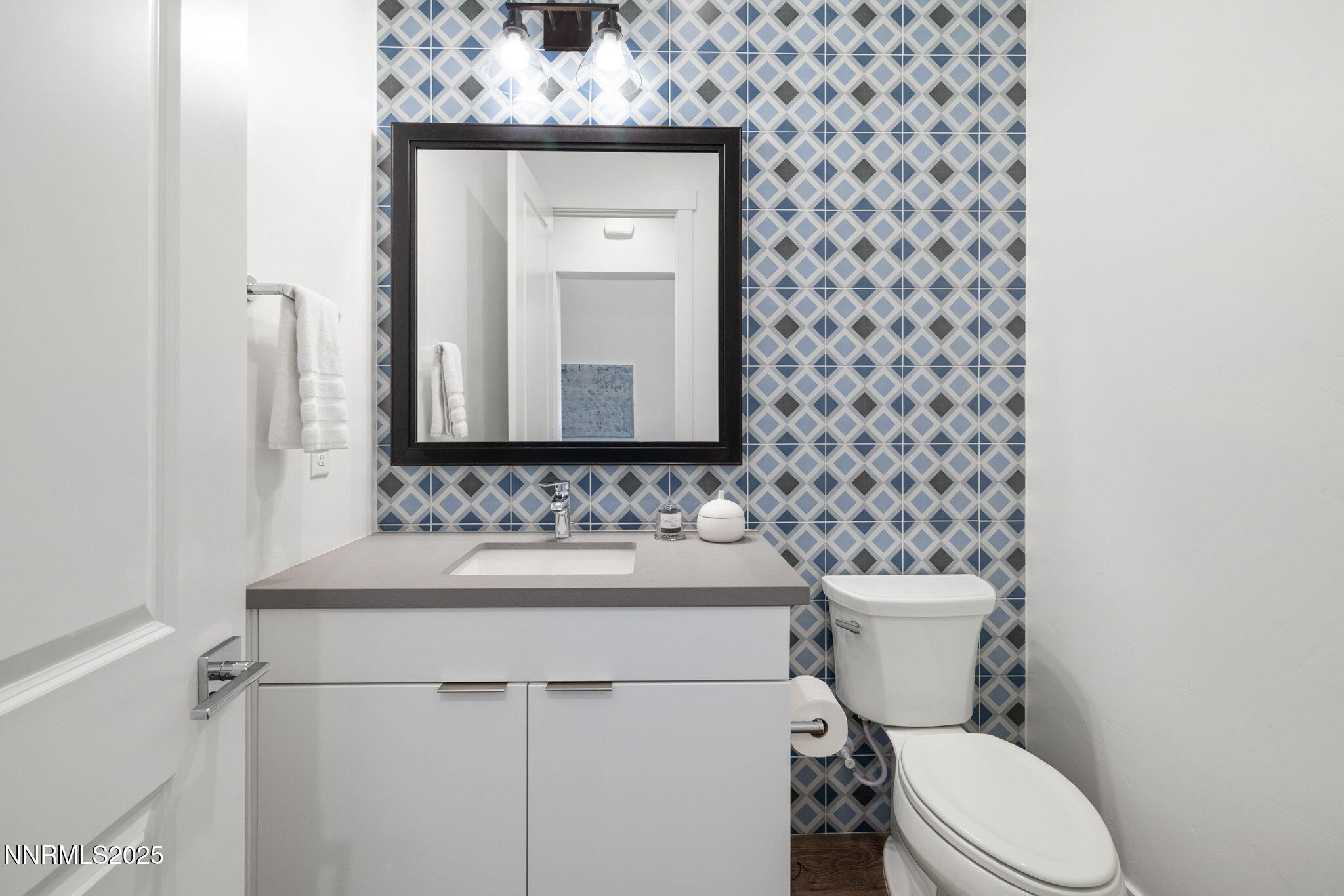 5406 Side Saddle Trail Reno, NV 89511 - Photo 17 of 39 a bathroom with a toilet sink and mirror