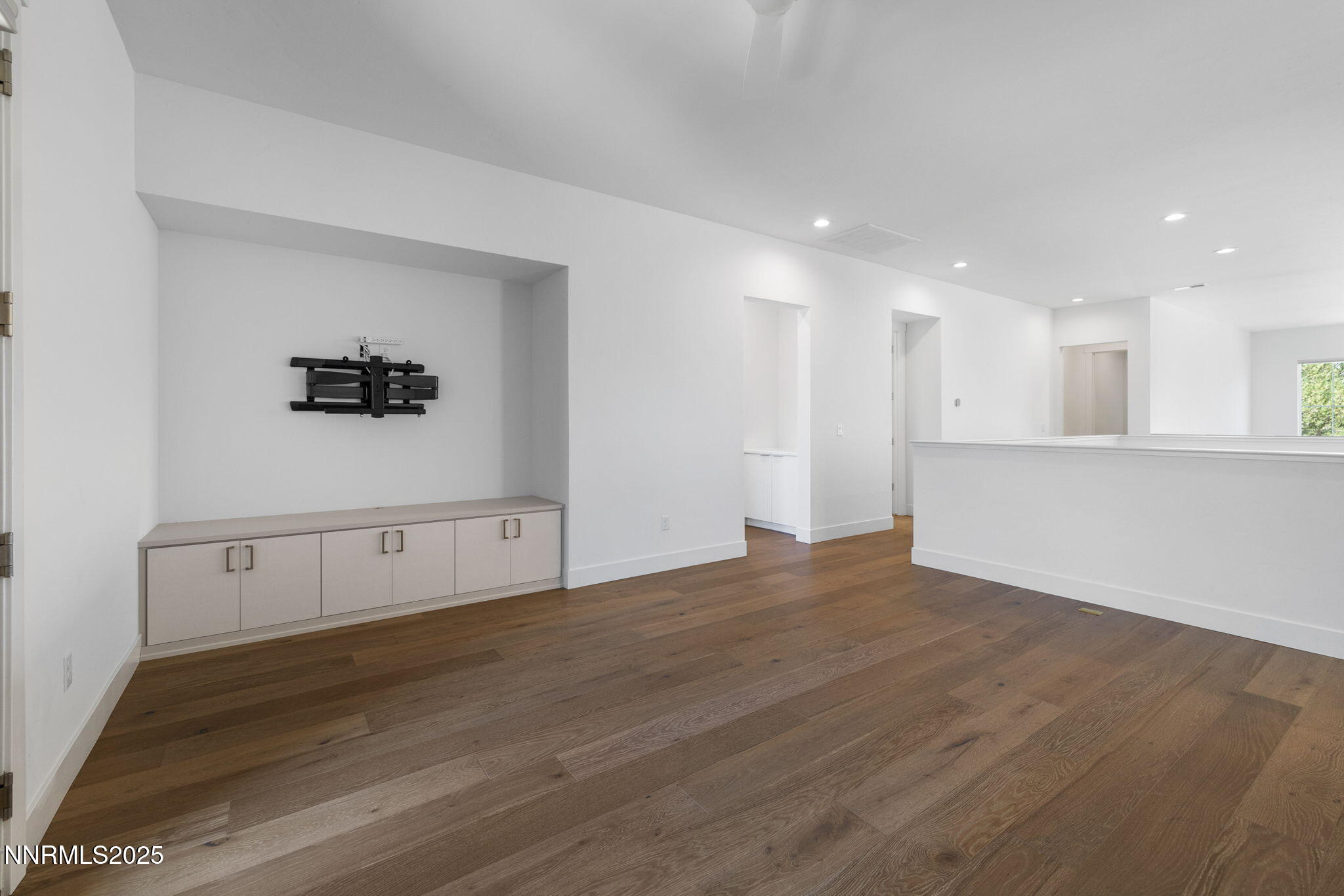 5406 Side Saddle Trail Reno, NV 89511 - Photo 19 of 39 a view of an empty room with wooden floor and windows