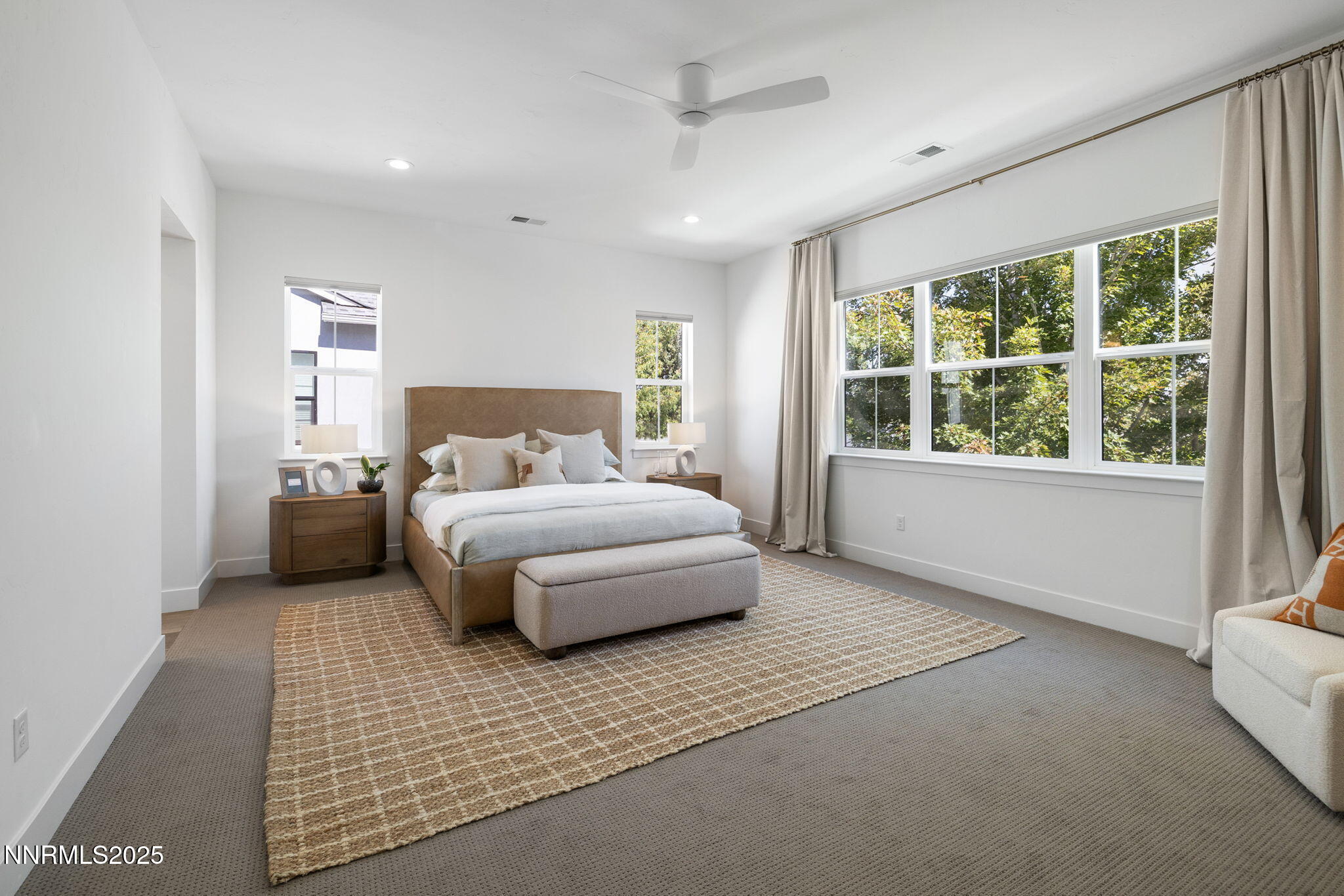 5406 Side Saddle Trail Reno, NV 89511 - Photo 20 of 39 a bedroom with a large bed and a large window