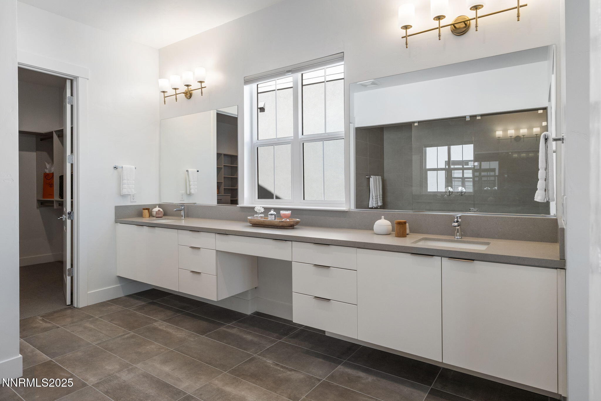 5406 Side Saddle Trail Reno, NV 89511 - Photo 21 of 39 a bathroom with double sink and a mirror