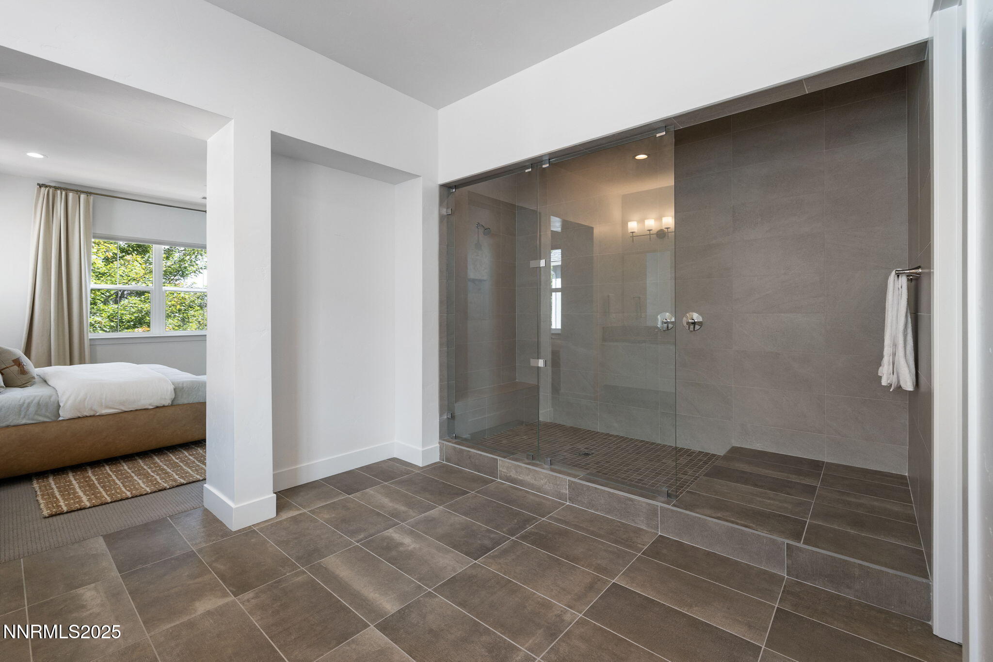 5406 Side Saddle Trail Reno, NV 89511 - Photo 22 of 39 a bathroom with a glass door shower