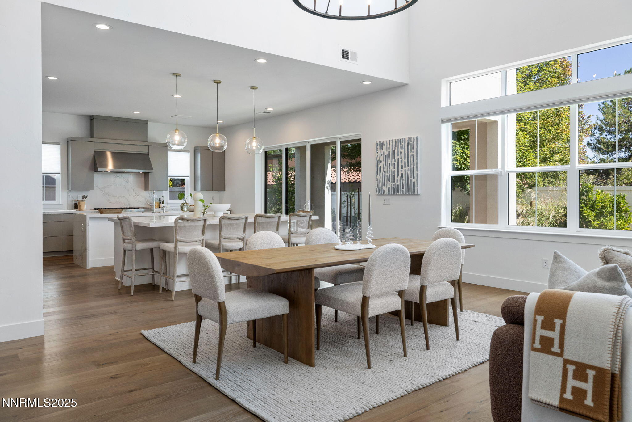 5406 Side Saddle Trail Reno, NV 89511 - Photo 4 of 39 a dining hall with stainless steel appliances kitchen island a table and chairs