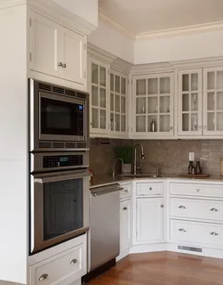 a kitchen with granite countertop a stove and a sink