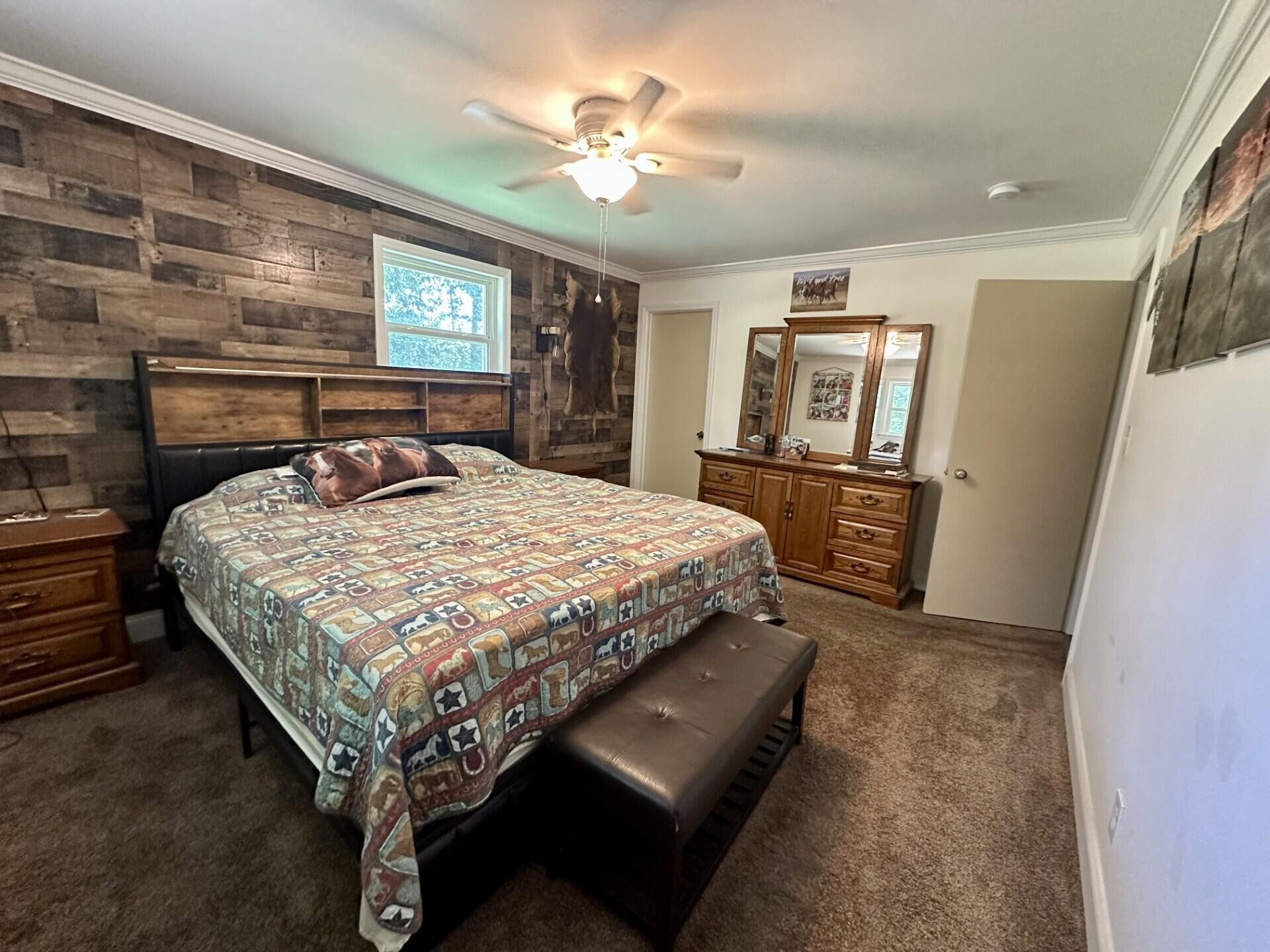 449 York Road Ocoee, TN 37361 - Photo 11 of 26 a bed sitting in a spacious bedroom next to a larger window