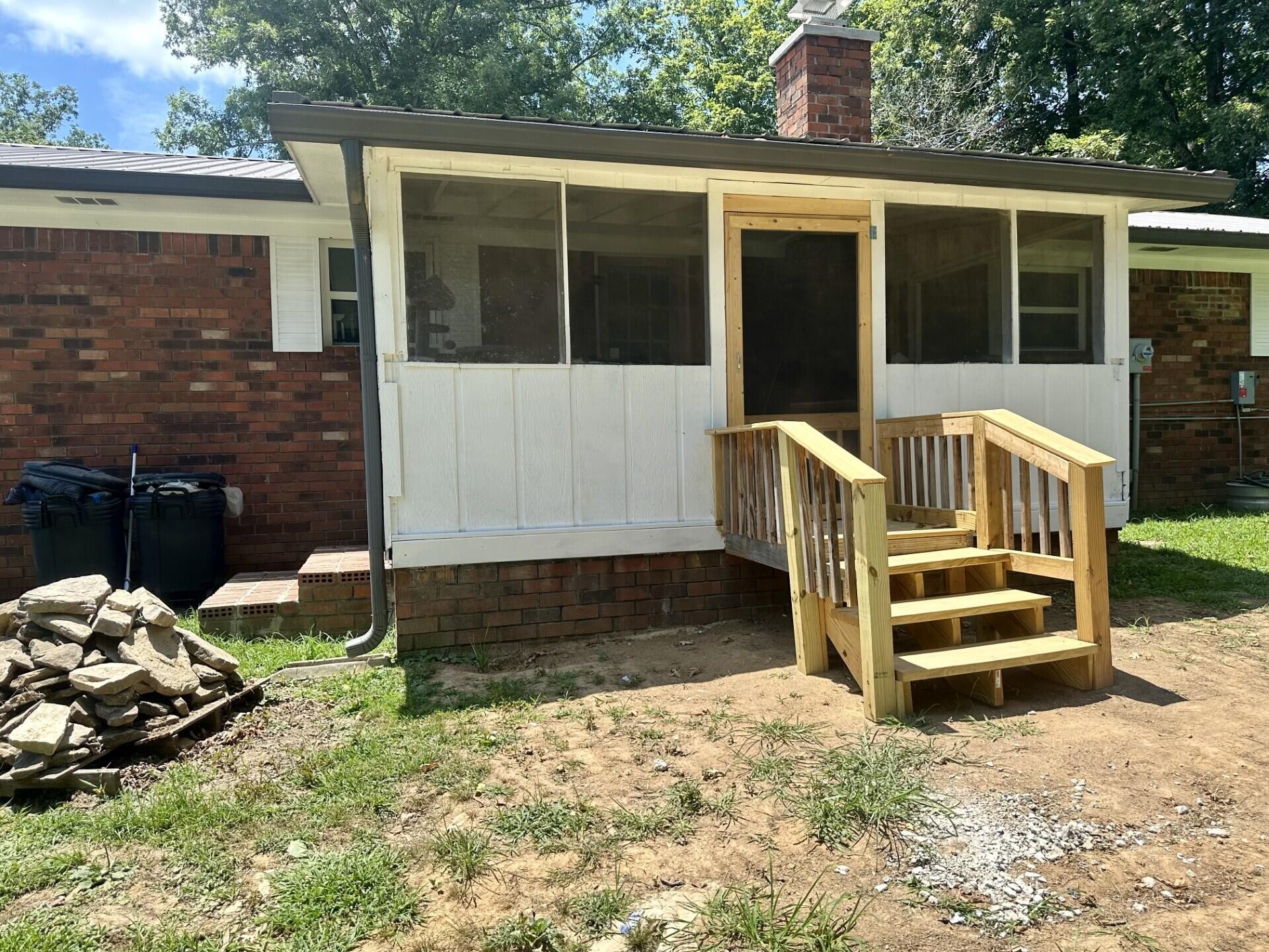 449 York Road Ocoee, TN 37361 - Photo 15 of 26 a front view of a house with a yard