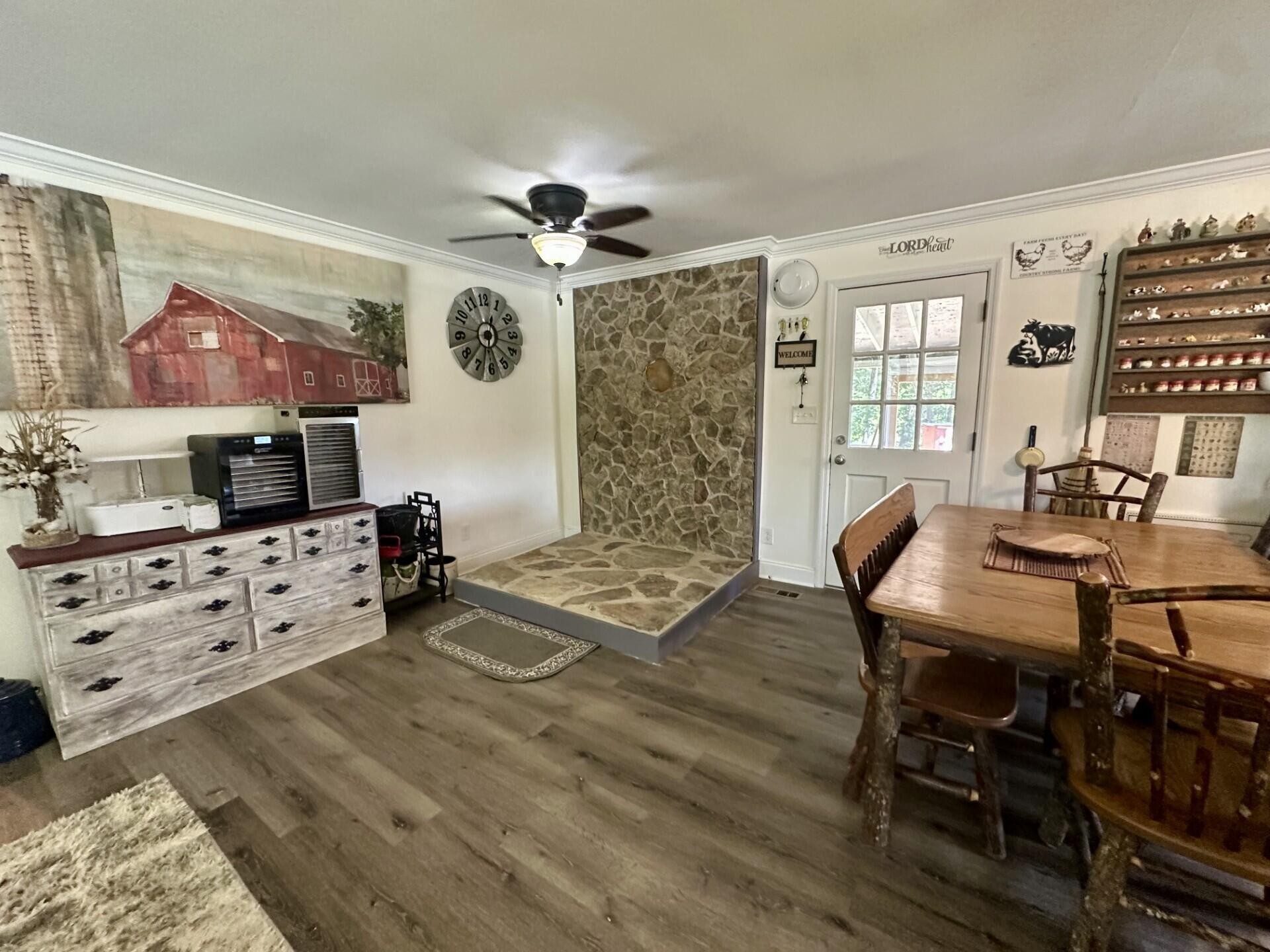 449 York Road Ocoee, TN 37361 - Photo 4 of 26 a view of a dining room with furniture a rug and wooden floor