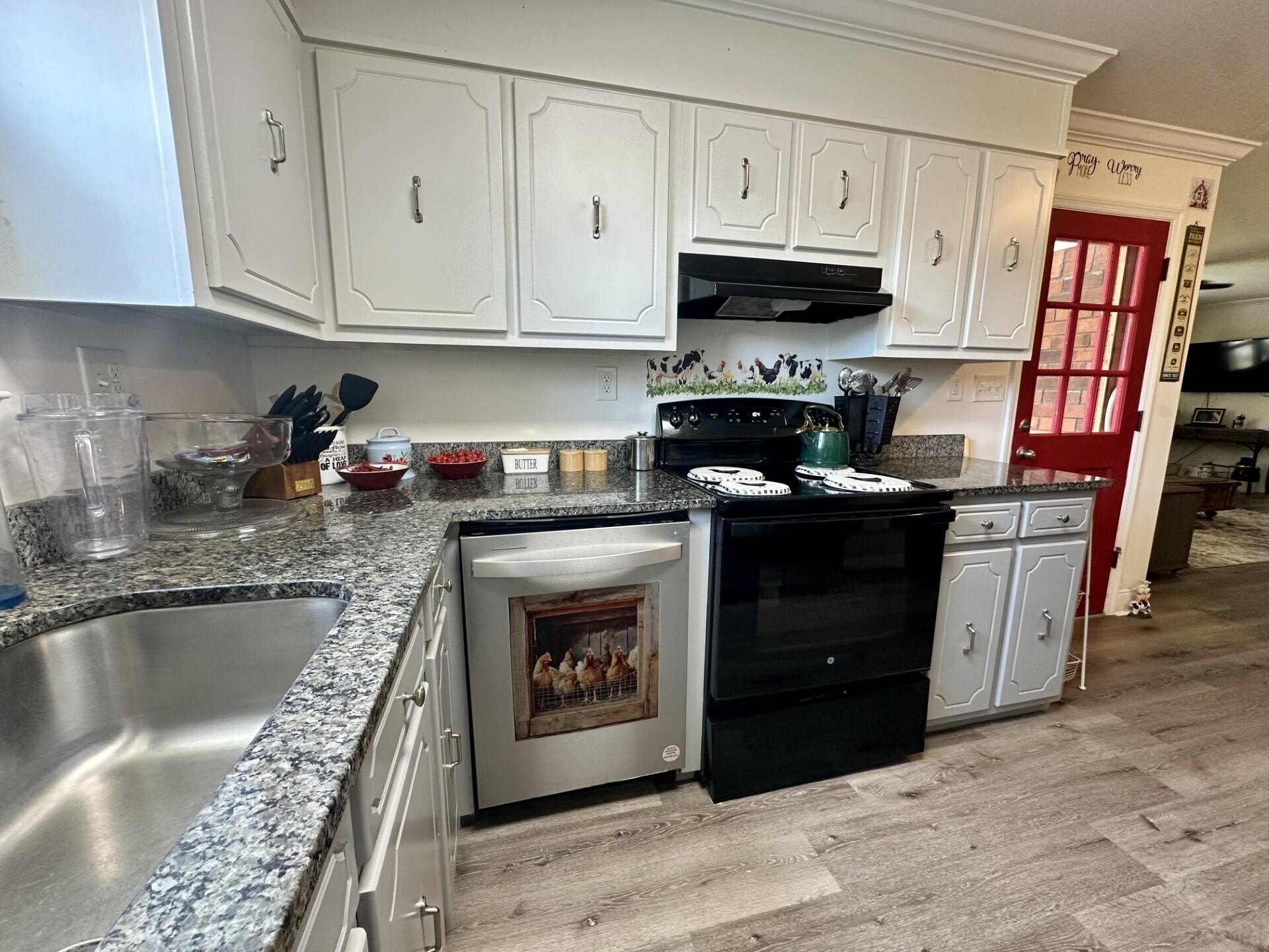 449 York Road Ocoee, TN 37361 - Photo 7 of 26 a kitchen with stainless steel appliances granite countertop a stove a sink and a microwave