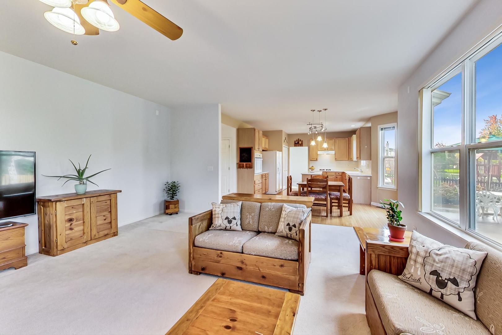 1552 Southgate Road Bartlett, IL 60103 - Photo 12 of 27 a living room with furniture and a large window