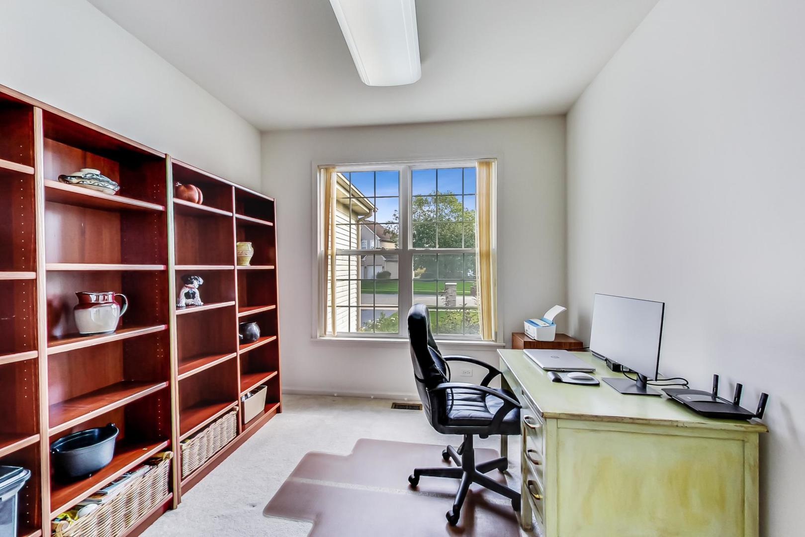 1552 Southgate Road Bartlett, IL 60103 - Photo 14 of 27 a view of a workspace with furniture and a window