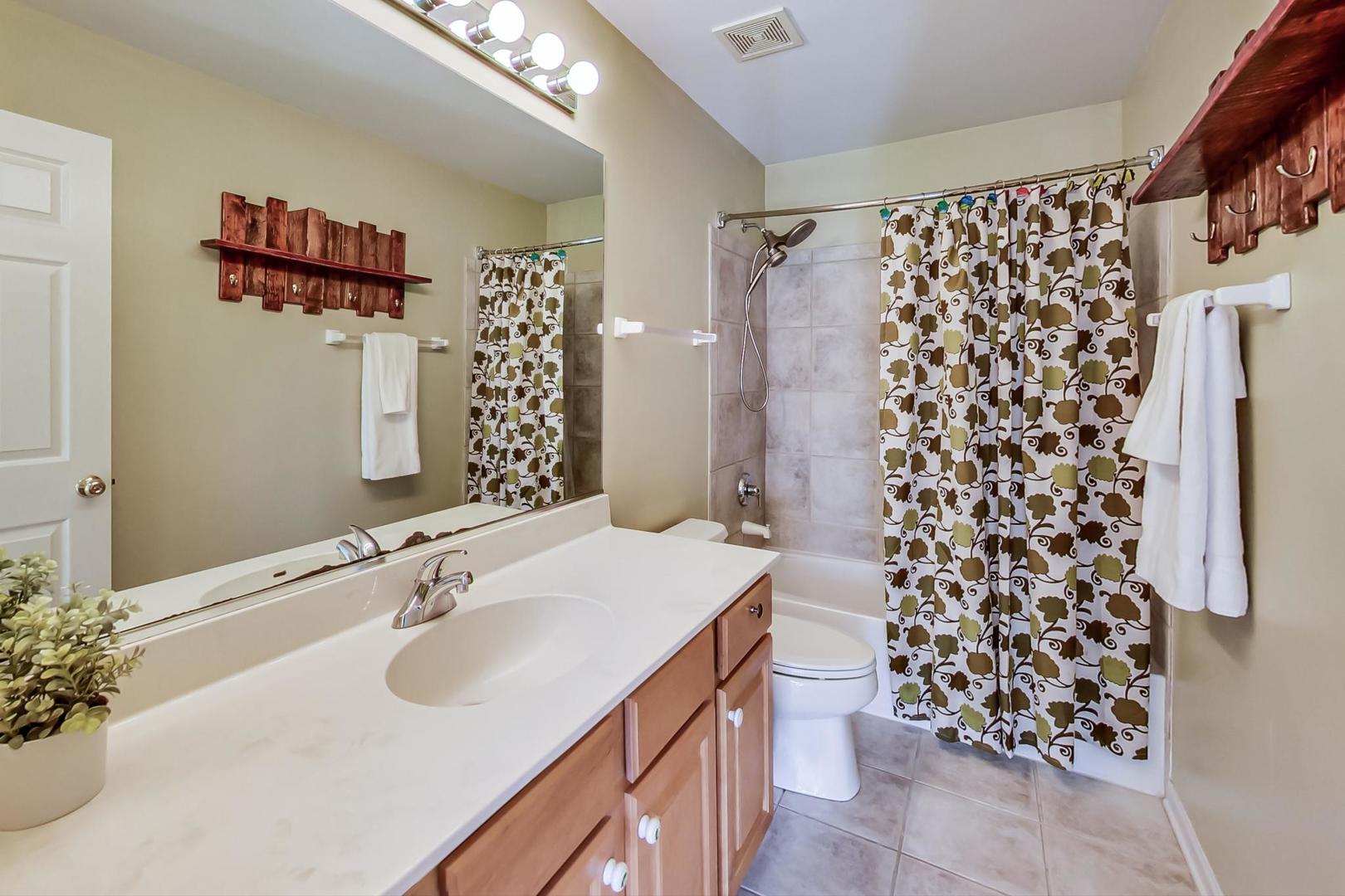 1552 Southgate Road Bartlett, IL 60103 - Photo 19 of 27 a bathroom with a sink and a mirror