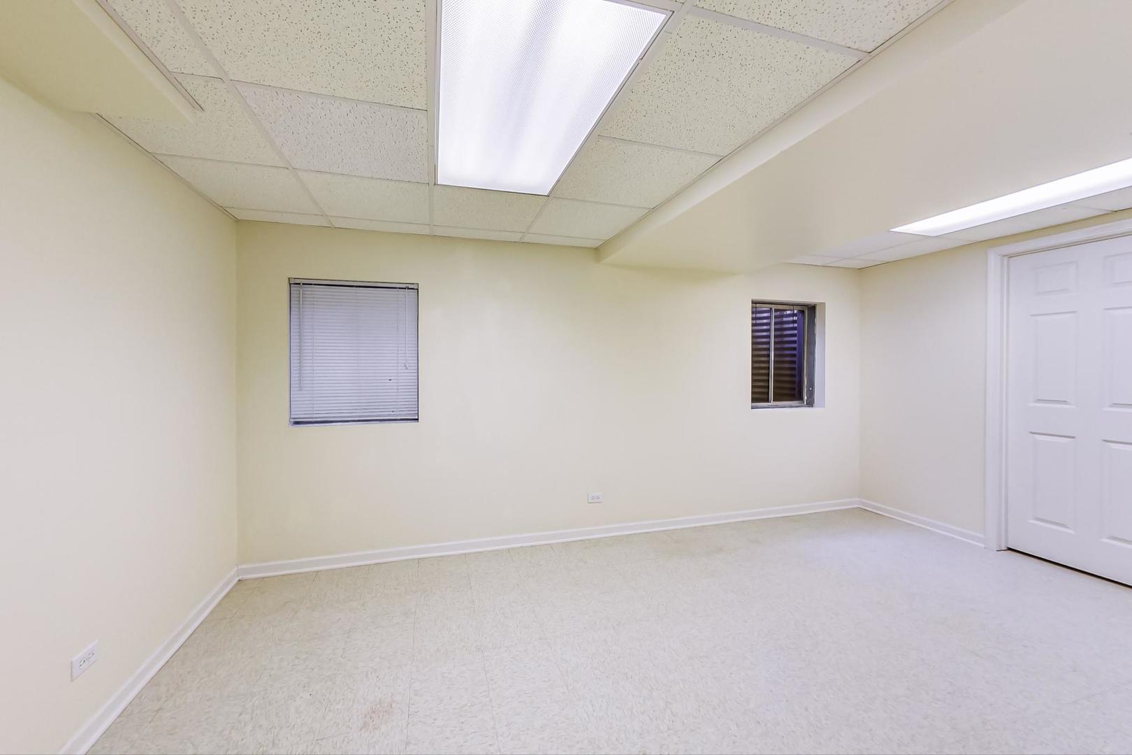 1552 Southgate Road Bartlett, IL 60103 - Photo 22 of 27 an empty room with a empty space and windows
