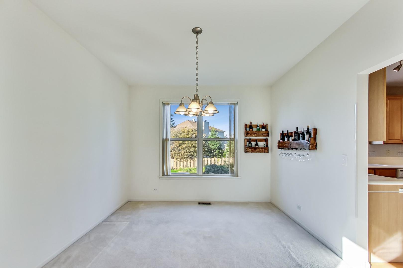 1552 Southgate Road Bartlett, IL 60103 - Photo 7 of 27 a view of a room with window and hallway