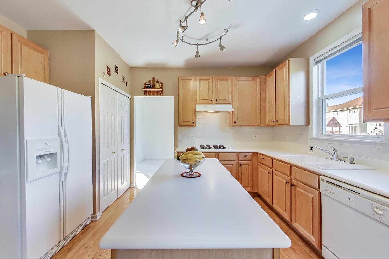 1552 Southgate Road Bartlett, IL 60103 - Photo 9 of 27 a kitchen with refrigerator and window
