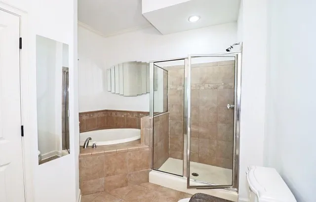 a bathroom with a shower and bathtub
