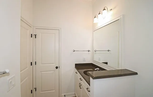 a close view of a utility room with dryer and washer