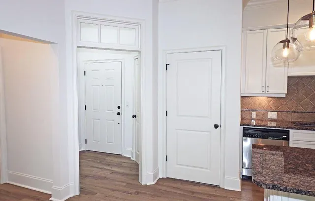 a view of a kitchen from the hallway