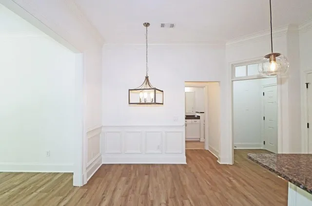 a view of a room and wooden floor