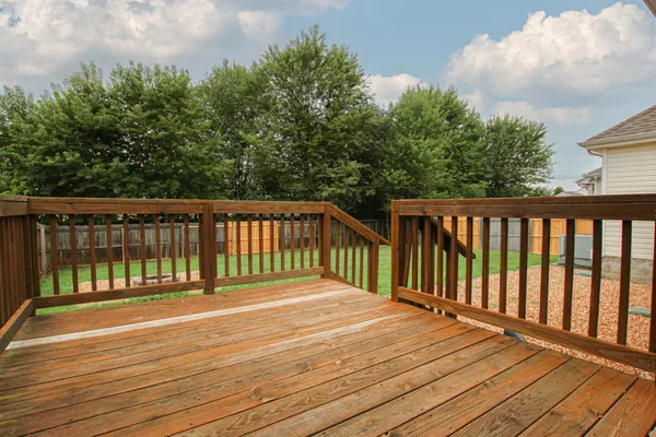 a balcony with wooden floor