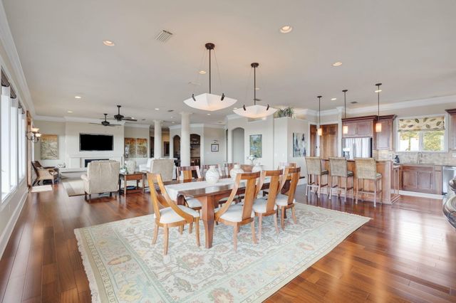 a view of a kitchen and dining room