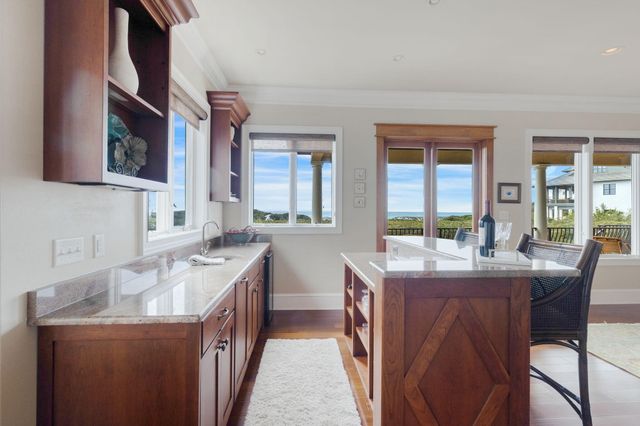 a view of a livingroom with furniture and a workspace