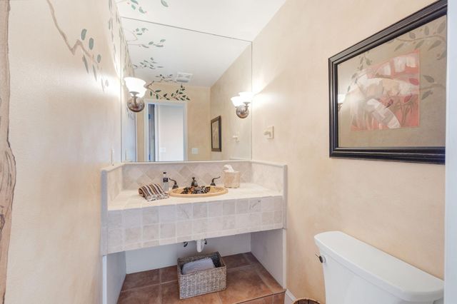 a bed room with a bed couch and a window