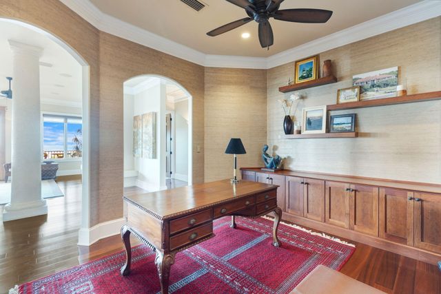 a bath tub sitting in a bathroom next to a window