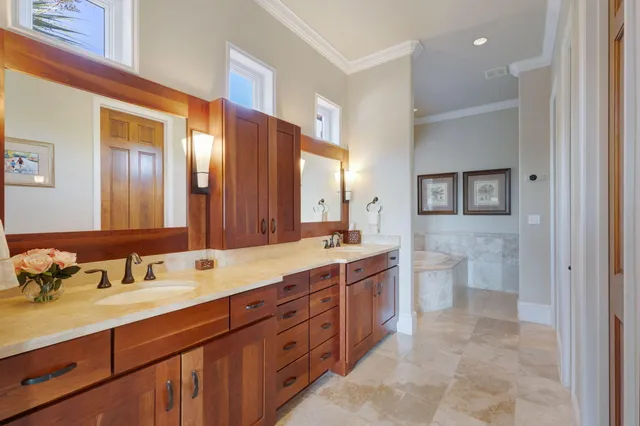a bathroom with a sink vanity and a mirror