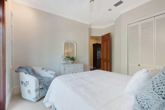 a view of a room with furniture and wooden floor