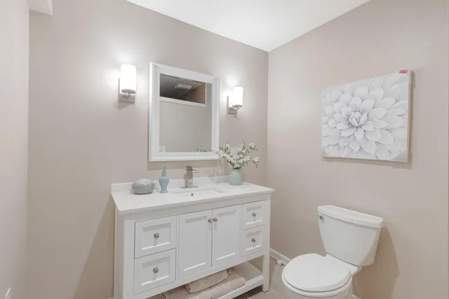 a view of a house with a tree in the background