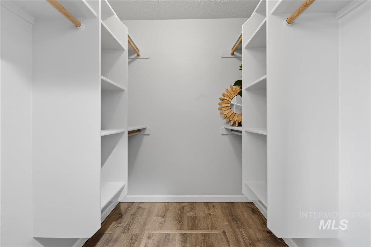 25022 Tumbleweed Road Middleton, ID 83644 - Photo 20 of 41 Walk in closet with light wood-style floors