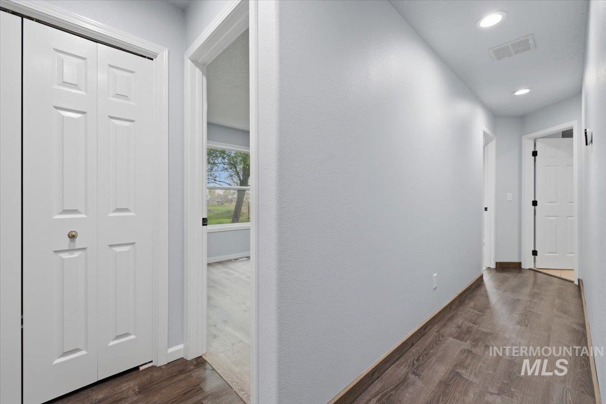 25022 Tumbleweed Road Middleton, ID 83644 - Photo 24 of 41 Corridor featuring dark wood-style floors and recessed lighting