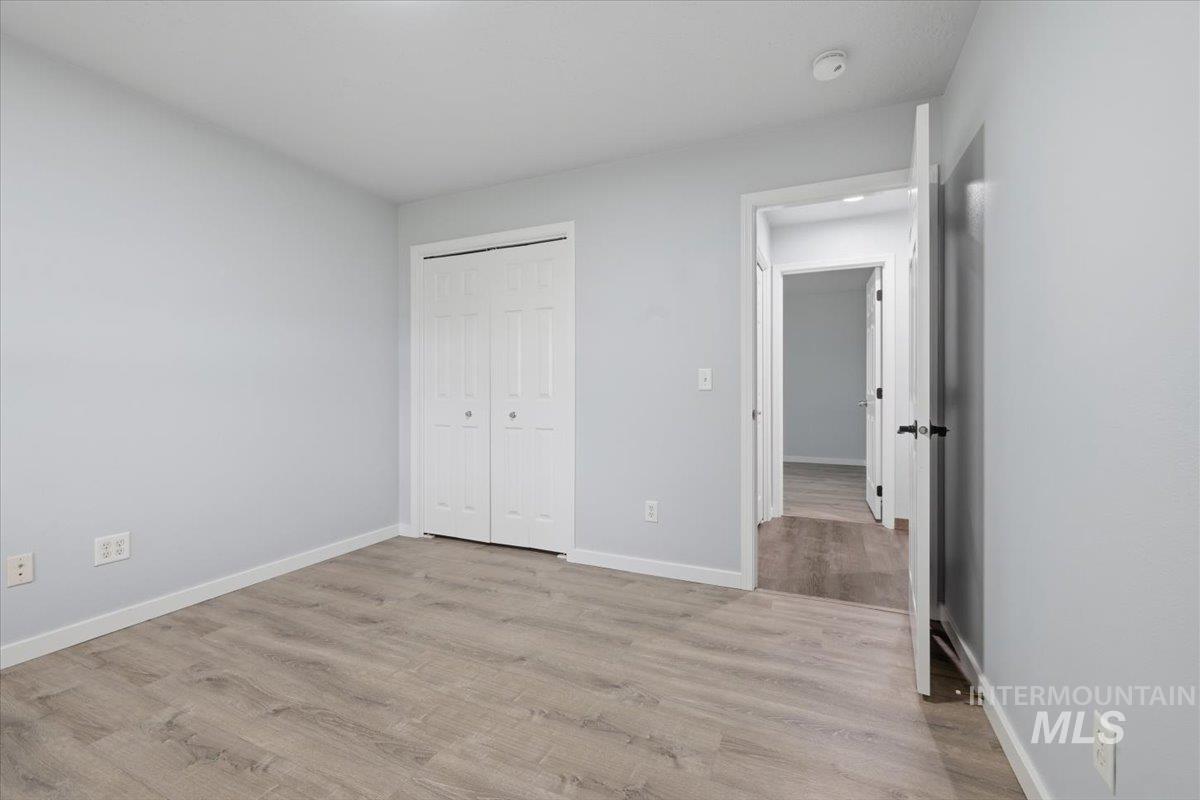 25022 Tumbleweed Road Middleton, ID 83644 - Photo 30 of 41 Unfurnished bedroom with a closet and light wood-type flooring