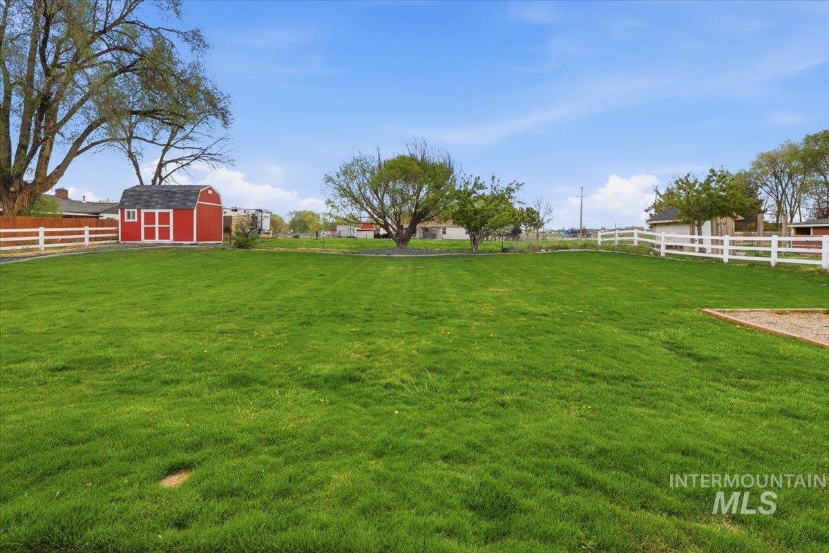 25022 Tumbleweed Road Middleton, ID 83644 - Photo 34 of 41 Fenced backyard featuring a storage unit