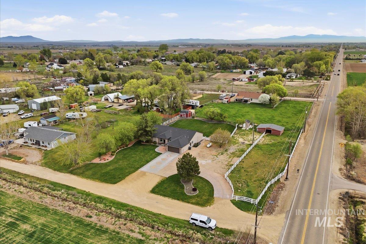 25022 Tumbleweed Road Middleton, ID 83644 - Photo 38 of 41 Aerial view of residential area featuring a mountainous background