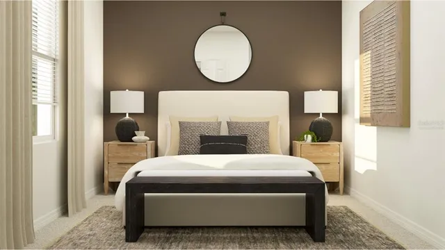 a bedroom with a bed a mirror and a window