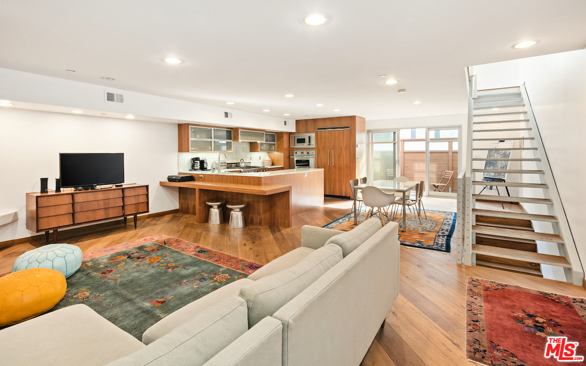 512 Brooks Avenue, Unit 4 Venice, CA 90291 - Photo 1 of 25 a living room with furniture and a flat screen tv