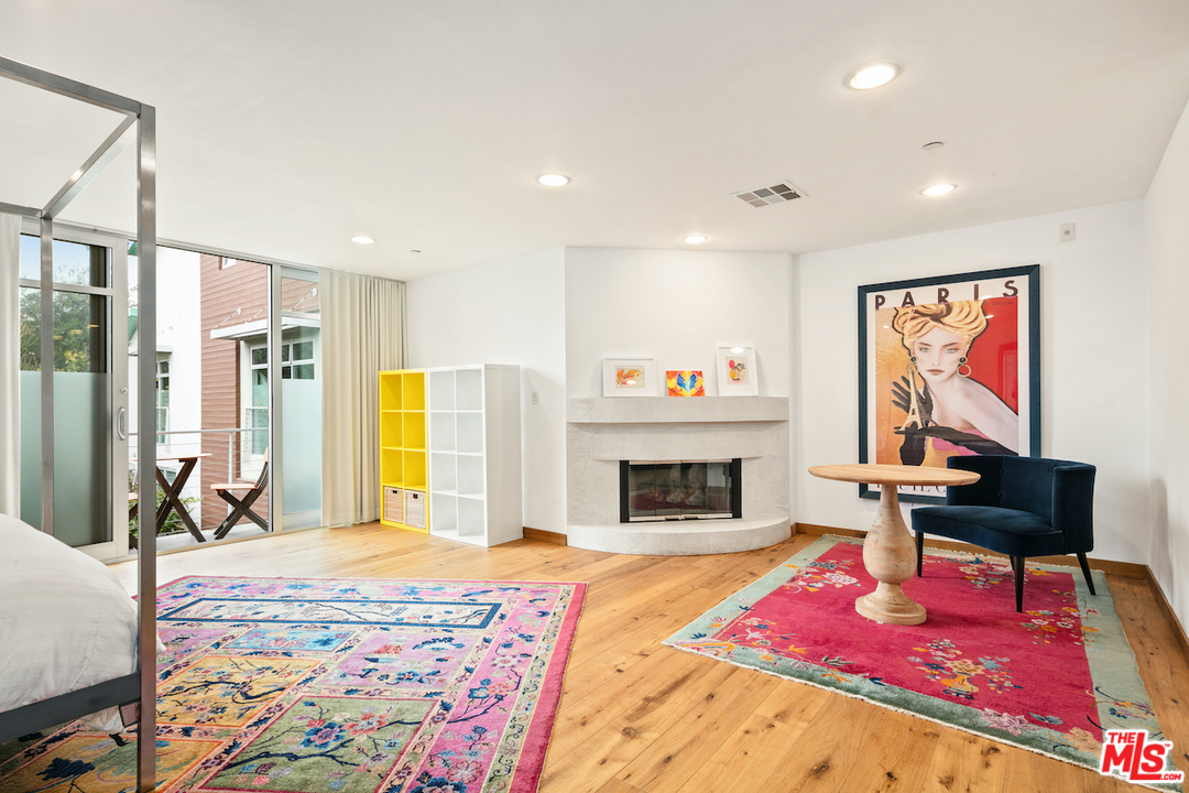 512 Brooks Avenue, Unit 4 Venice, CA 90291 - Photo 14 of 25 a bedroom with a bed and a flat screen tv